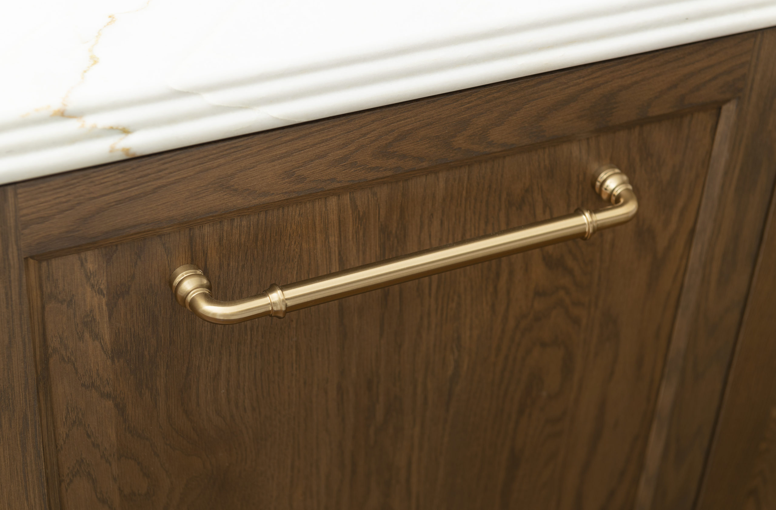 Close up of cabinet handle on kitchen cabinet