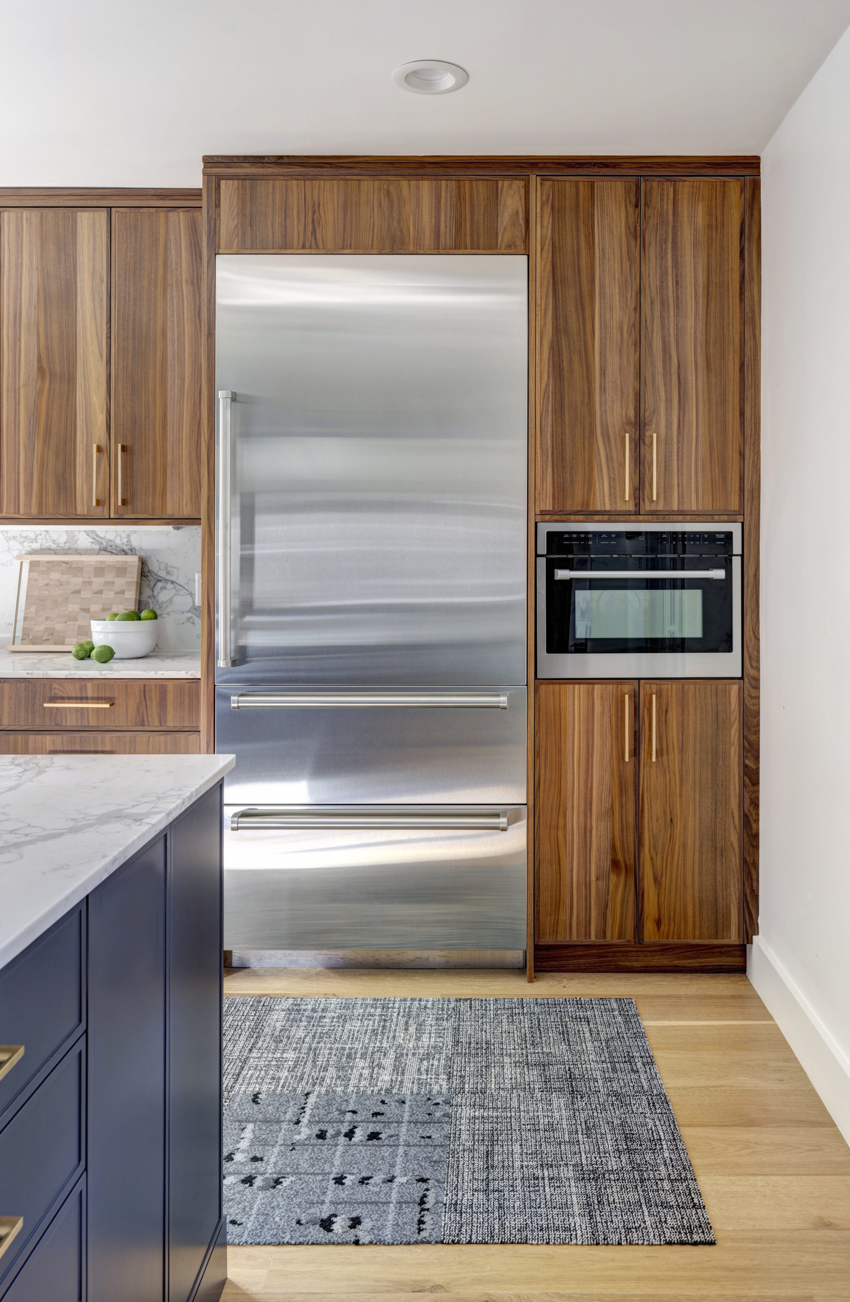 Tall pantry in kitchen with doors closed