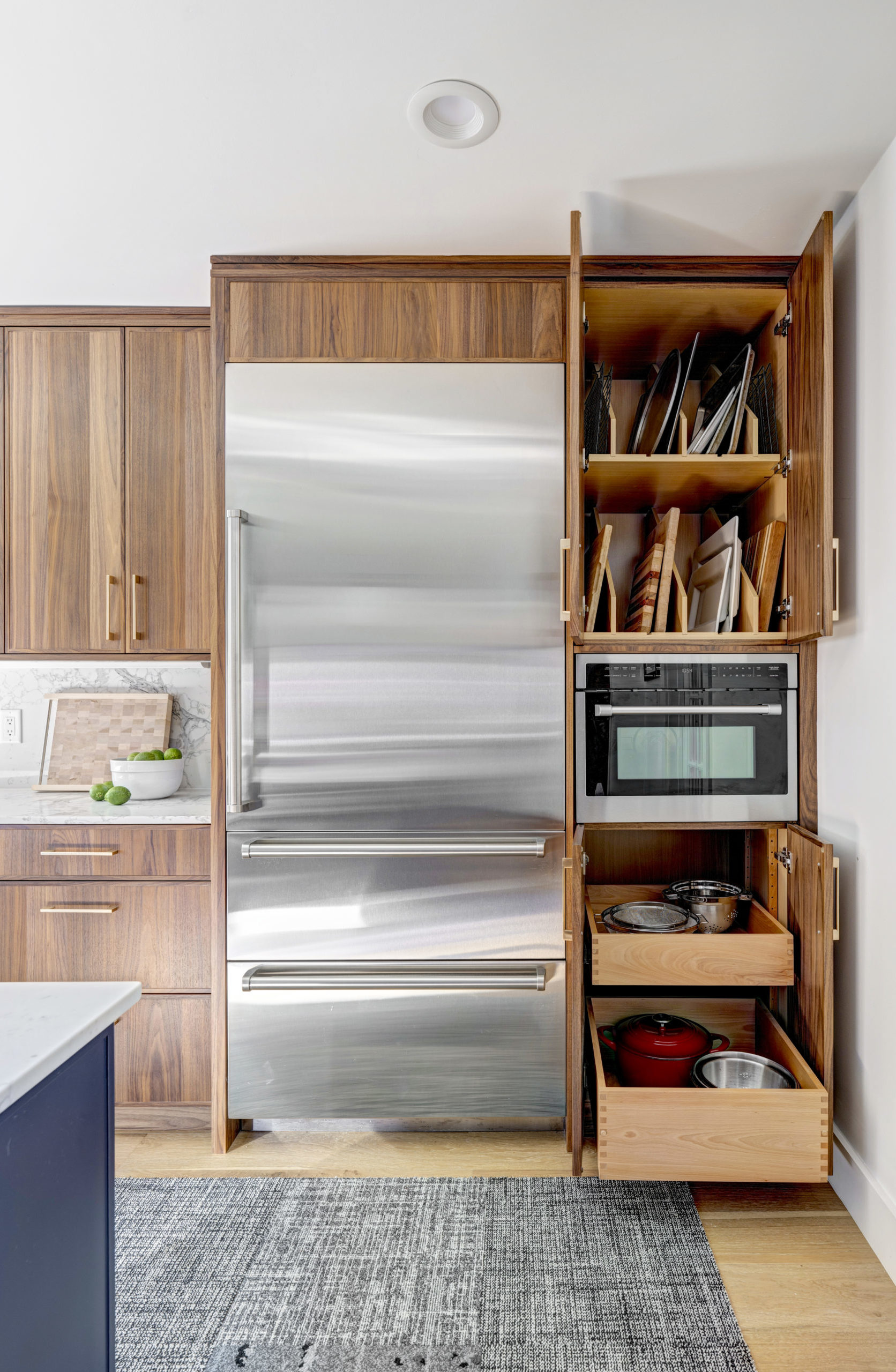 Tall pantry in kitchen with doors open