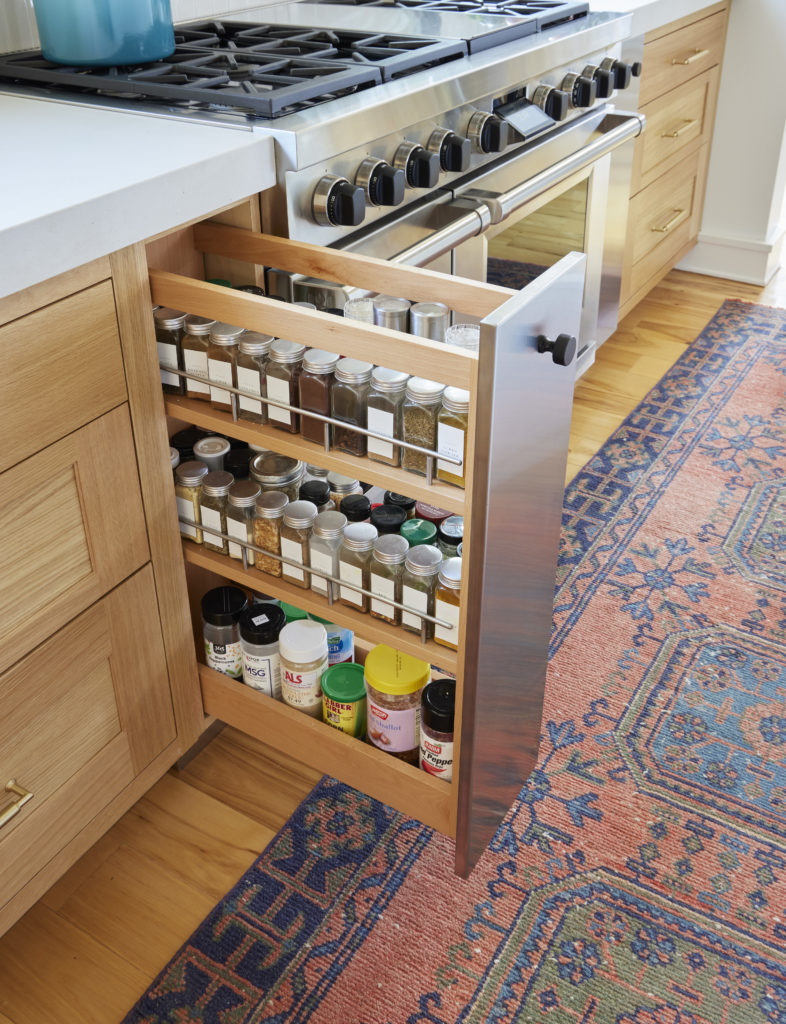 Built-in pull-out spice rack in kitchen